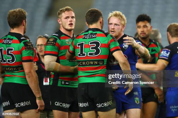 Sam Burgess of the Rabbitohs embraces James Graham of the Bulldogs following the round 23 NRL match between the South Sydney Rabbitohs and the...