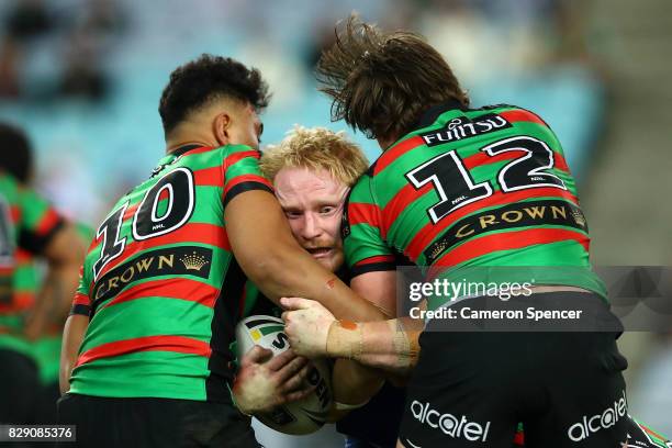 James Graham of the Bulldogs is tackled during the round 23 NRL match between the South Sydney Rabbitohs and the Canterbury Bulldogs at ANZ Stadium...