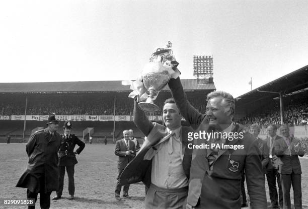 Holding the Football League Championship trophy aloft are Derby County's manager Brian Clough and his deputy Peter Taylor. 20/09/04: The former...