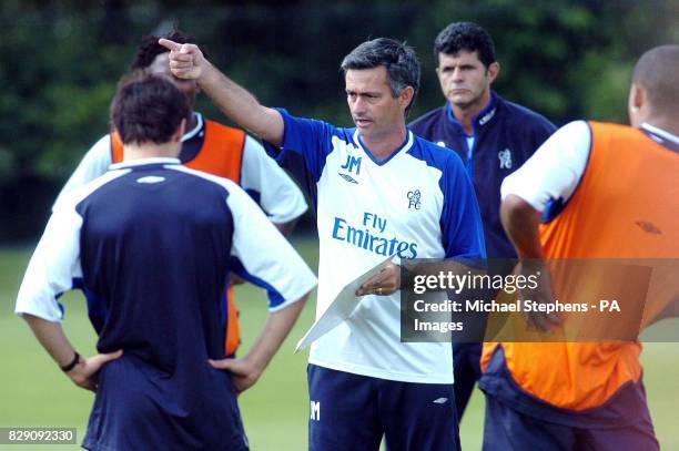 New Chelsea manager Jose Mourinho gestures to his players during a pre-season training session in Harlington, West London. Chelsea prepare ahead of...