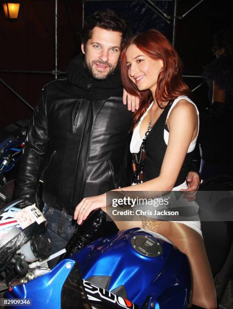 Aaron Young and Olga Alechusa sit on a motorbike at the opening for the Gagosian Gallery Opening "for what you are about to receive" on September 17,...