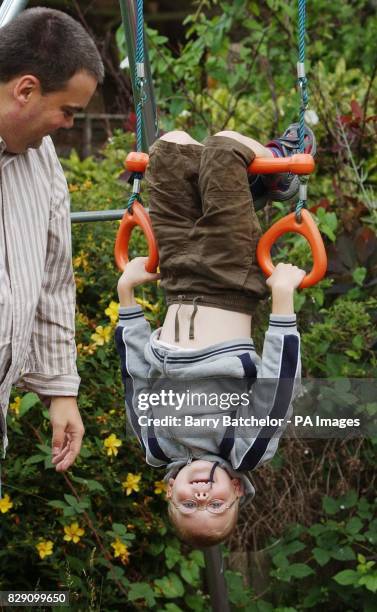 David Hartley watches one of his sons, Daniel, eight, at their home in Romsey, Hants. Mr Hartley has said, that bone marrow matches have now been...