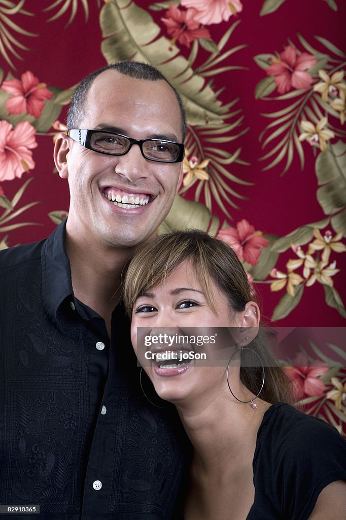 Couple laughing, floral background