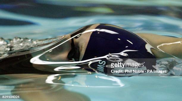 Melanie Marshall of Loughborough University breaks through the water as she qualifies for the 50m backstroke final during the ASA national swimming...