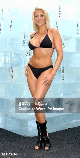 Glamour model Jo Hicks poses for photographers in front of a 10-tonnes ice cube at Broadgate Arena near London's Liverpool Street Station. The 2.5...