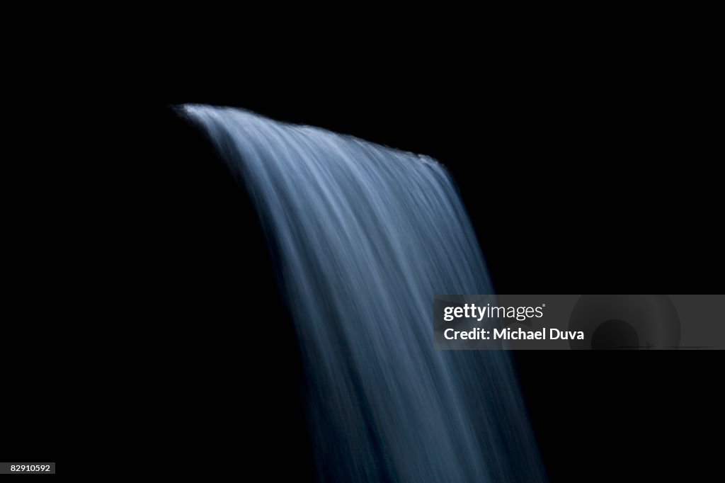 Waterfall against black background