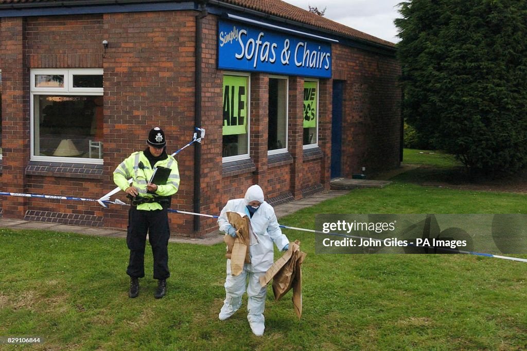 A police forensic officer with evidence