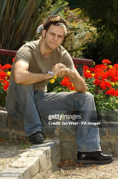 Former member of boy band 5ive Scott Robinson poses for photographers during a photocall to promote the new theatre production of Boogie Nights 2 at...