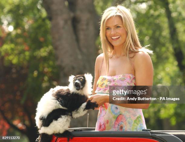 Presenter Katy Hill with a South American Lima during a photocall to launch the Nintendo Konga Beach party at London Zoo in Regents Park, central...