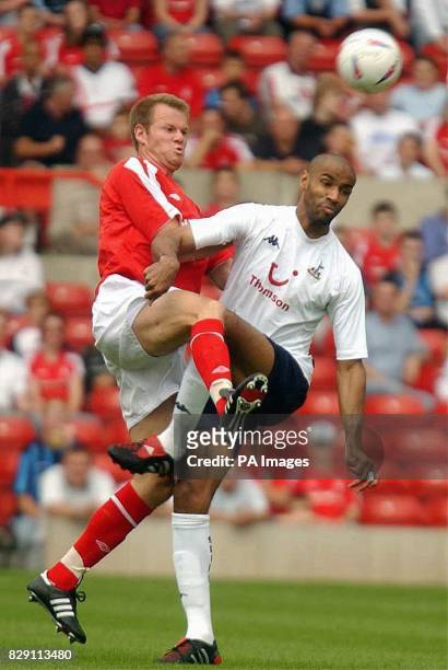 Spurs striker Frederic Kanoute holds off Forest's Jon Olav Hjelde. During their pre-season friendly match at the City Ground, Nottingham, Saturday...