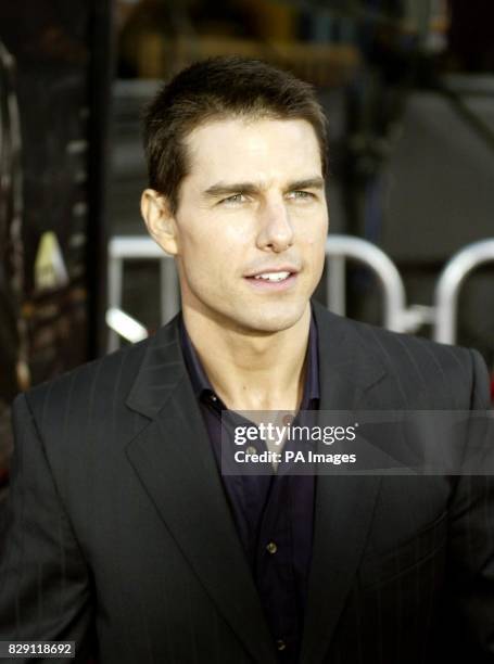 Actor Tom Cruise, star of the new thriller film 'Collateral' posse for the photographersas he arrives at the film's premiere in Los Angeles. The film...