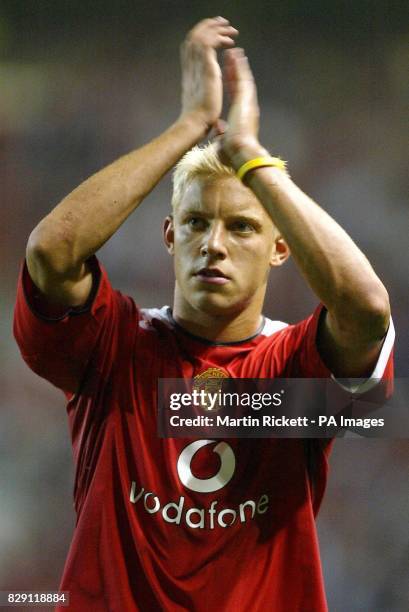 New signing Alan Smith salutes the fans after his first match for Manchester United at Old Trafford against PSV Eindhoven during their Vodafone Cup...