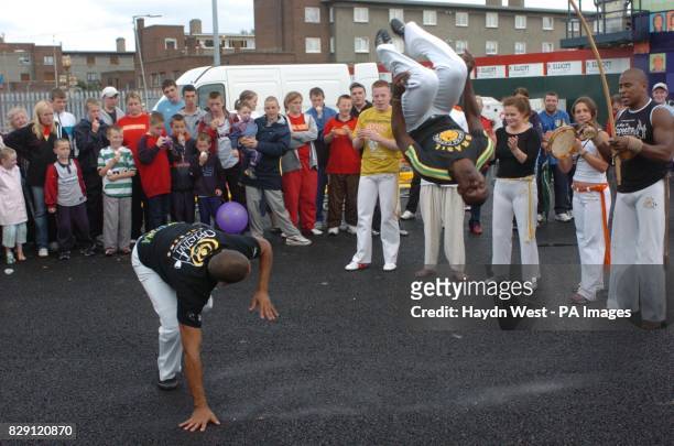 Brazilan dance troupe, Oficina da Capoeira, performing at a street party, to launch a major regeneration project at Fatima Mansions, a South Dublin...