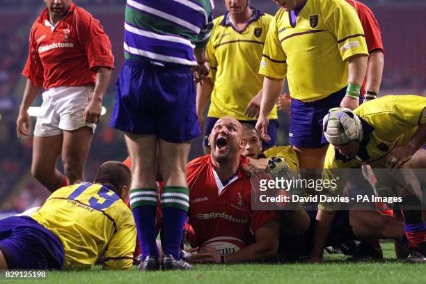 Wales' Craig Quinnell celebrates scoring a try against Romania during the Rugby Union International game between Wales and Romania at Millennium...