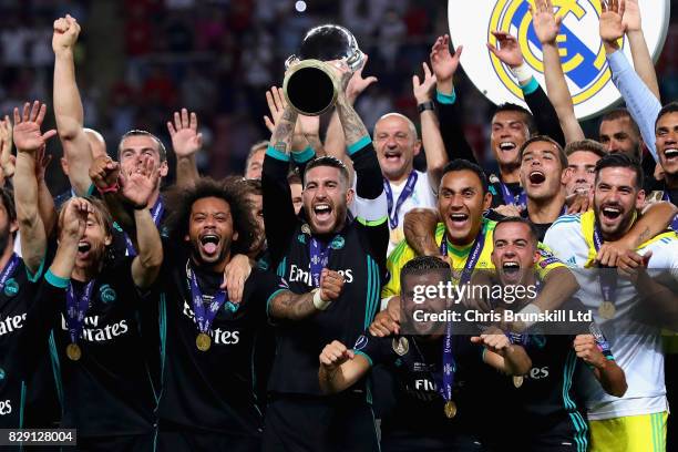 Sergio Ramos of Real Madrid lifts the trophy as his team celebrate the win after the UEFA Super Cup match between Real Madrid and Manchester United...