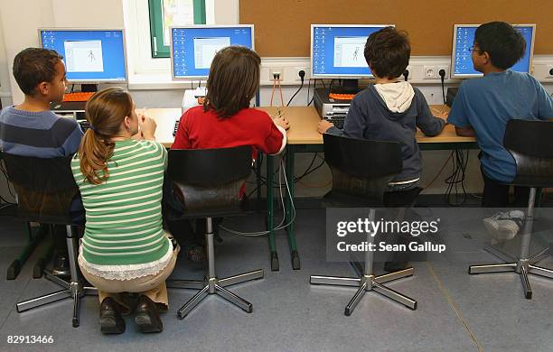 Fourth-grade students learn computer skills in the elementary school at the John F. Kennedy Schule dual-language public school on September 18, 2008...