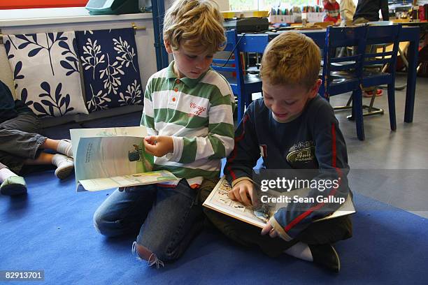 Second-grade children read books in the elementary school at the John F. Kennedy Schule dual-language public school on September 18, 2008 in Berlin,...