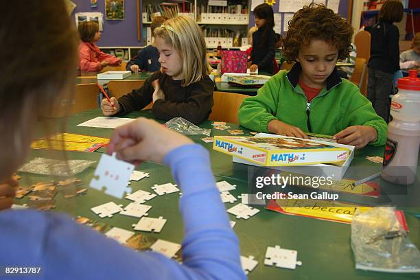 Second-grade children attend class in the elementary school at the John F. Kennedy Schule dual-language public school on September 18, 2008 in...