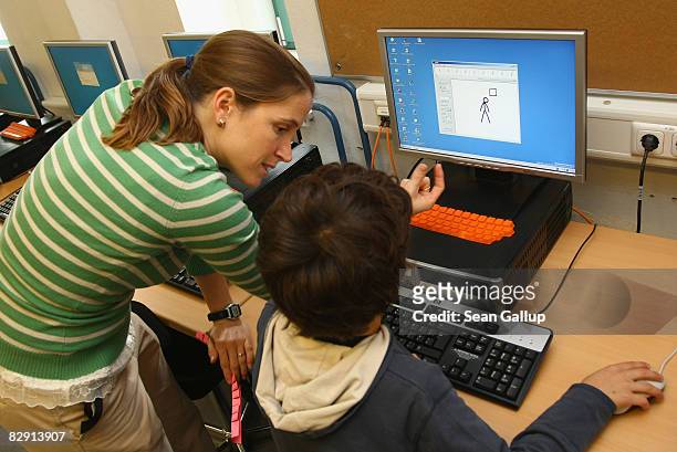 Fourth-grade students learn computer skills in the elementary school at the John F. Kennedy Schule dual-language public school on September 18, 2008...