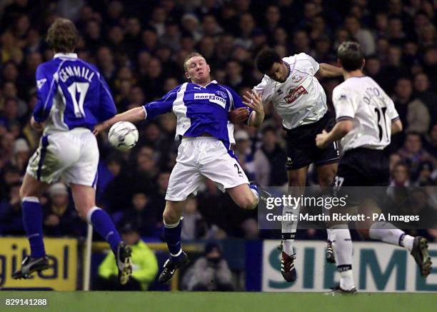 Derby County's Youl Mawene wins a header over Everton's Steve Watson , during their FA Barclaycard Premiership match at Everton's Goodison Park...