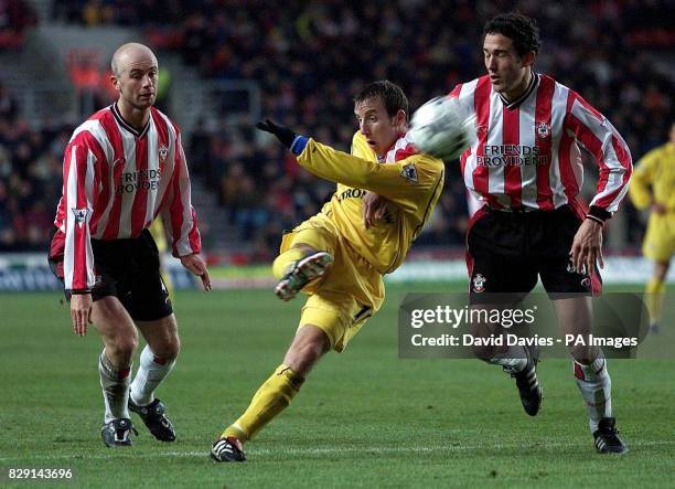 Lee Bowyer of Leeds United shoots under pressure from Paul Telfer and Chris Marsden of Southampton, during their FA Barclaycard Premiership match at...