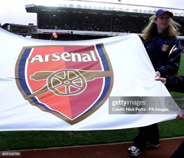 Arsenal's show off the new club crest to fans, launched at Highbury prior to their FA Barclaycard Premiership match with visiting Southampton, at...