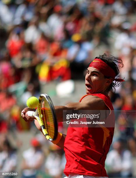 Rafael Nadal of Spain returns a backhand to Sam Querrey of the United States during day one of the semi final Davis Cup match between Spain and the...