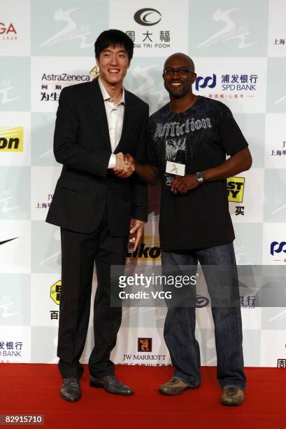Chinaese 110 meters hurdler Liu Xiang and Allen Johnson attend a party for the players who will attend the Shanghai Golden Grand Prix on September...