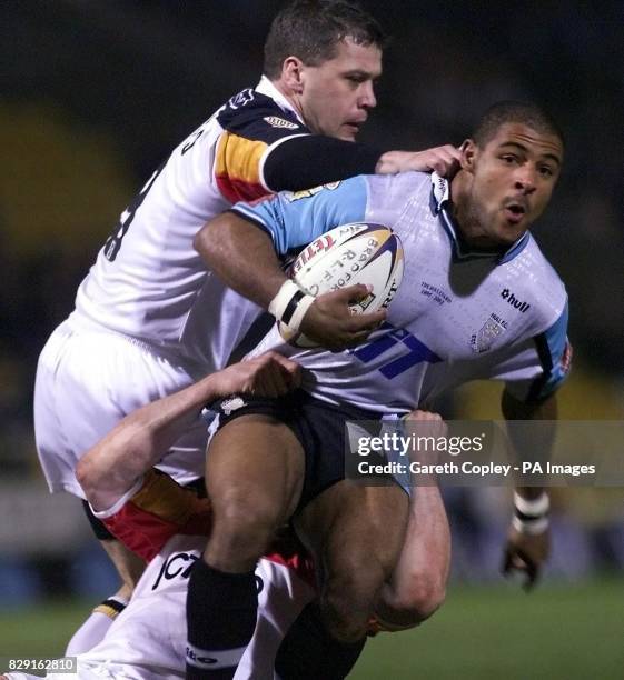 Bradford Bulls' James Lowes tackles Hull FC's Gareth Raynor, while Bradford's Lee Radford goes for a firmer grip during their Tetley Bitter Super...