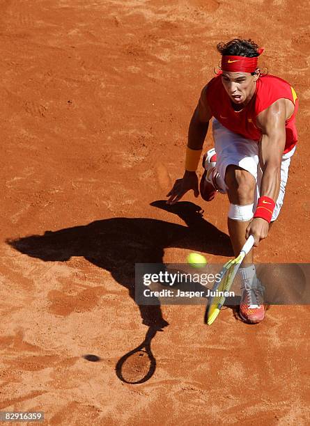 Rafael Nadal of Spain returns a shot to Sam Querrey of the United States during day one of the semi final Davis Cup match between Spain and the...