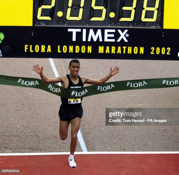 S Khalid Khannouchi crossing the winning line in the Flora London Marathon. Khalid Khannouchi smashed his own world record in an official time of two...