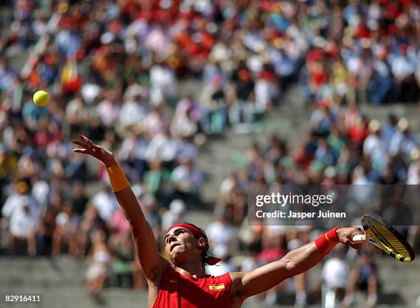 Rafael Nadal of Spain serves the ball to Sam Querrey of the United States during day one of the semi final Davis Cup match between Spain and the...
