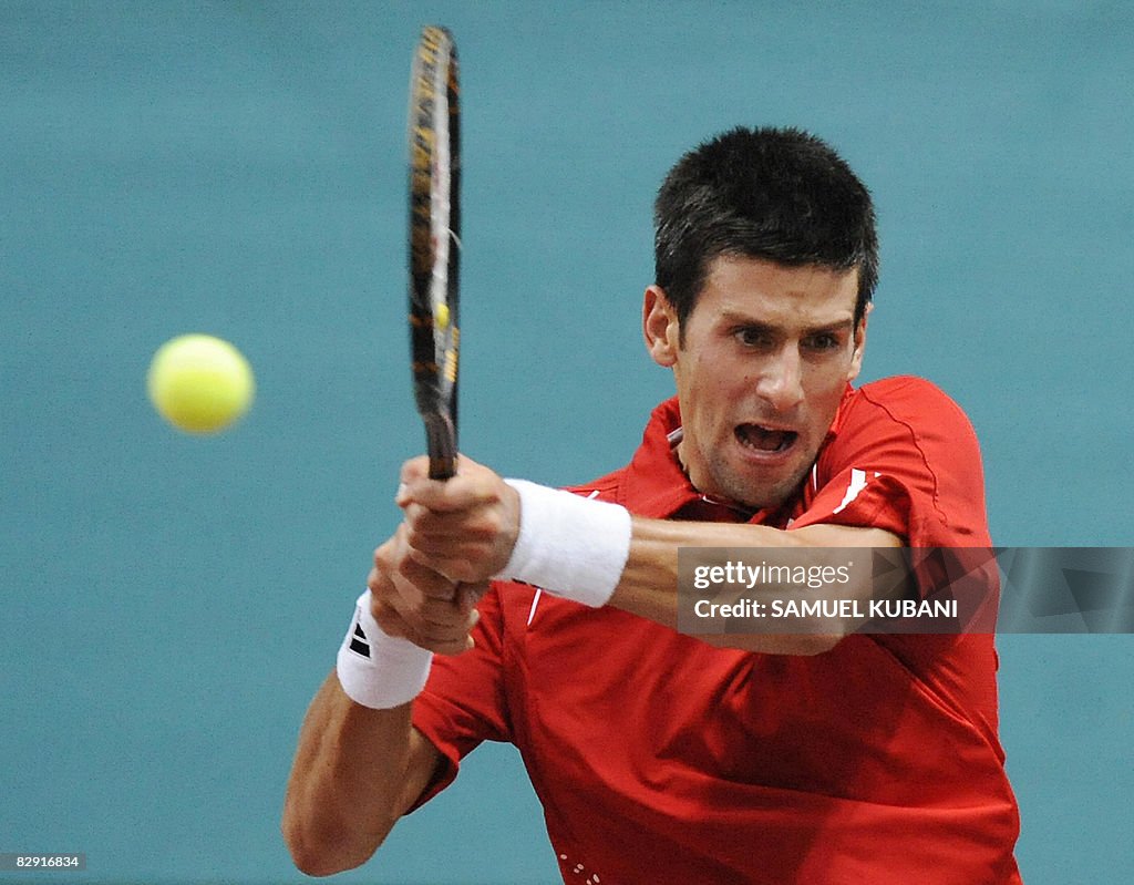 Novak Djokovic of Serbia returns the bal