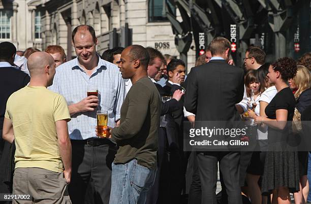City workers enjoy a drink during an extended lunch at the end of a long week on September 19 2008 in London, England. UK shares have gone up...