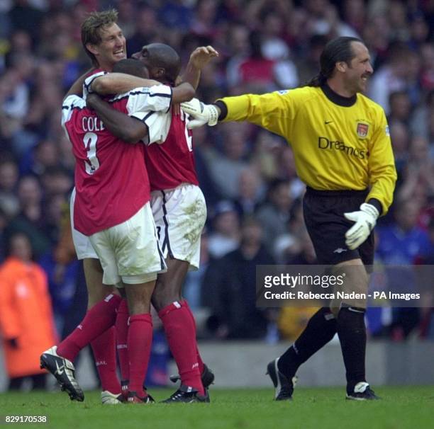 Arsenal's Tony Adams, Ashley Cole, Sol Campbell and David Seaman celebrate at the final whistle after defeating london rivals Chelsea 2-0 during the...