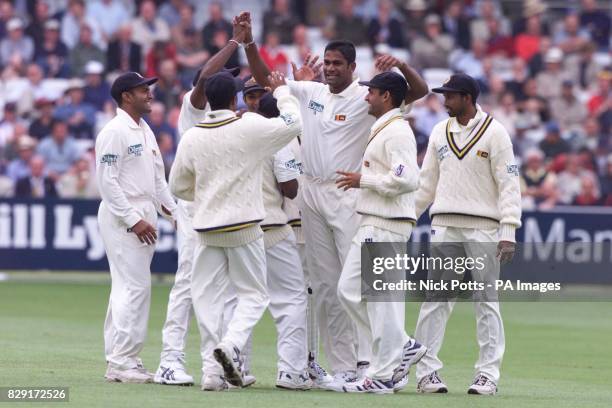 Sri Lanka's Nuwan Zoysa celebrates taking the wicket of England's Marcus Trescothink for 13, during 2nd day of the npower 1st Test at Lords, London.