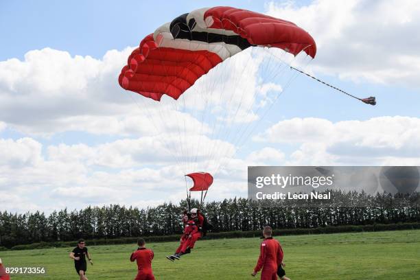 Former paratrooper Fred Glover comes into land during a skydive at the Old Sarum airfield on August 10, 2017 in Salisbury, England. Chelsea Pensioner...