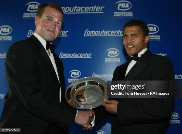 Sale Rugby Union Football Club wing Jason Robinson is presented with the PRA Computacenter Players' Player of the year award by Peter Philips, at...