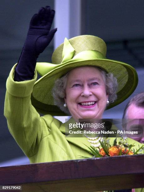 Queen Elizabeth II waves to the crowd at Epsom Downs for the running of The Derby. * 7/8/02: The Queen's Golden Jubilee summer celebrations come to...
