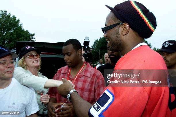 World Heavyweight Boxing Champion Lennox Lewis is greeted by Memphis born actor Cybil Shepherd , after leaving the Lorraine Motel in Memphis - the...