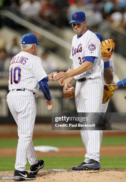 Pitcher Steven Matz of the New York Mets hands the ball to Manager Terry Collins as he is removed from an MLB baseball game against the Los Angeles...