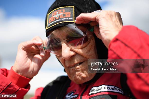 Former paratrooper Ted Pieri checks his goggles before completing a skydive at the Old Sarum airfield on August 10, 2017 in Salisbury, England....