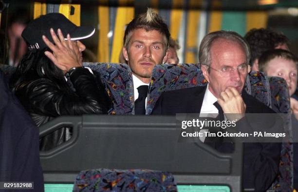 England's David Beckham and manager Sven-Goran Eriksson onboard the team coach on arrival at Heathrow Airport, London. The England team have arrived...