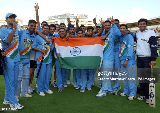 The Indian cricket team celebrate after beating England in The NatWest Series final at Lord's Cricket Ground in London.