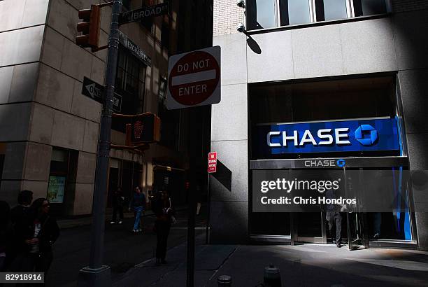 Man enters a Chase bank branch near the corner of Wall Street and Broad Street September 19 in New York City. The White House announced a plan that...