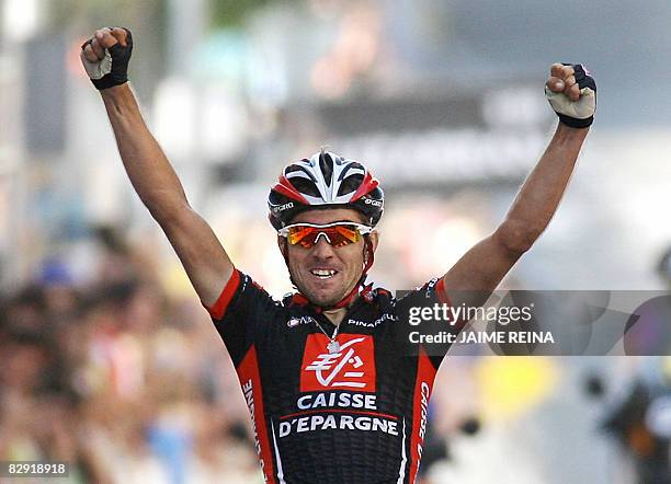 Spain's David Arroyo of Caisse D'Epargne celebrates at the finish line during the seventeenth stage of the Tour of Spain, which ran from Las Rozas to...