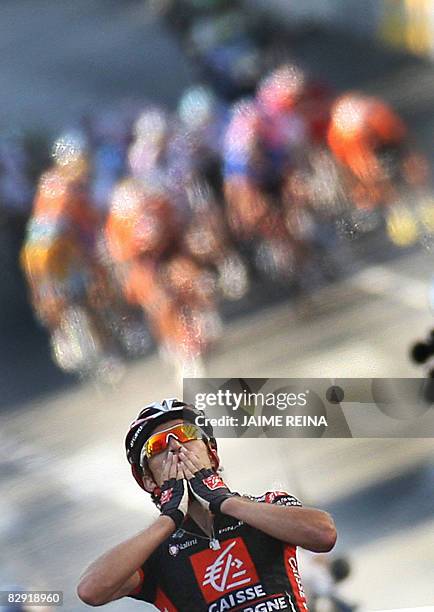 Spain's David Arroyo of Caisse D'Epargne celebrates at the finish line during the seventeenth stage of the Tour of Spain, which ran from Las Rozas to...