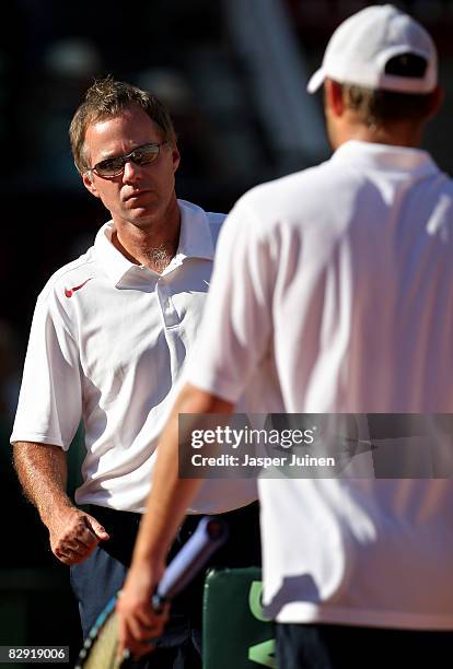 United States Davis Cup team captain Patrick McEnroe looks at his player Andy Roddick during day one of the semi final Davis Cup match between Spain...