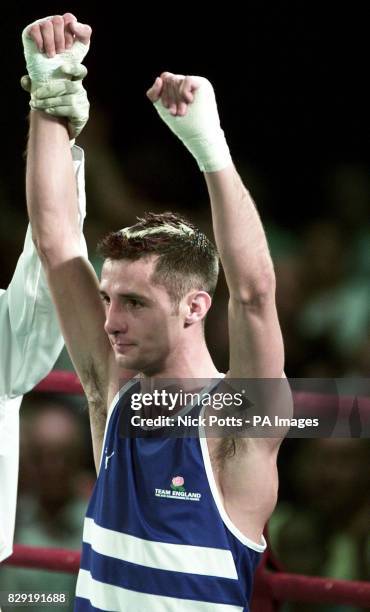 England Boxer Steve Bell celebrates victory over Devon Jones from Triandad & Tobago in the 57kg Boxing in the Commonwealth Games, at The Forum Centre...