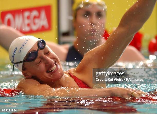 England's Karen Pickering celebrates after winning gold in the Women's 200m freestyle at the Manchester Aquatic Centre, Manchester.